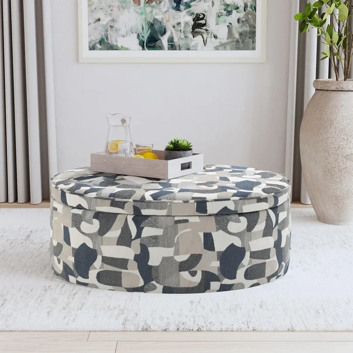 Tomkins Indigo Blue Oval Upholstered Storage Ottoman